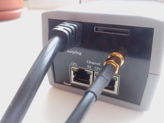A plugged GSM antenna in a NetPing 2 PWR-220 v2 SMS device