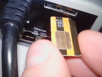 Installing a SIM card into a NetPing 2 PWR-220 v2 SMS device